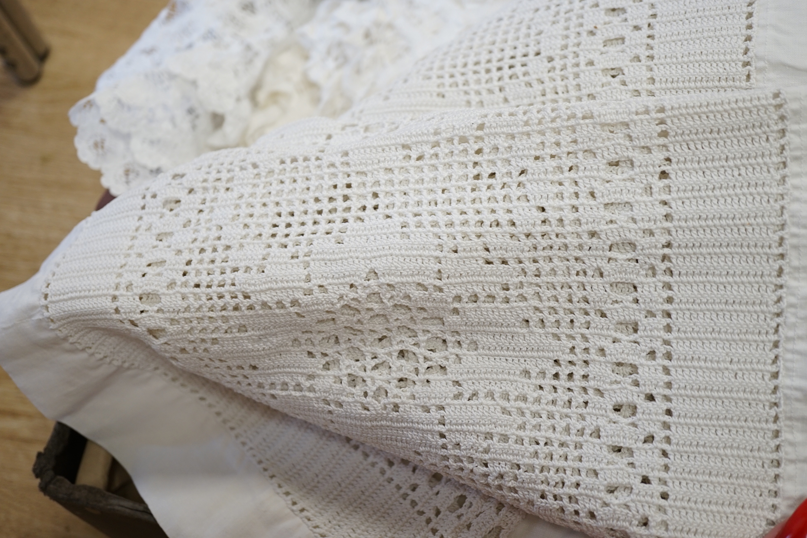 A collection of linen crochet and tape lace edged table cloths